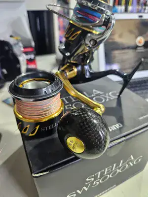 shimano - stella sw 5000xg+שפולה וחוטים+ידית קרבון