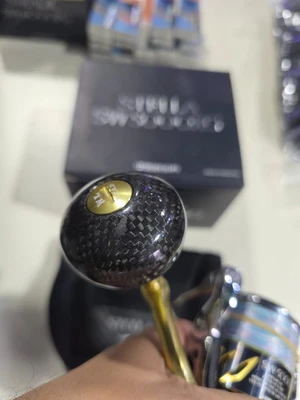 shimano - stella sw 5000xg+שפולה וחוטים+ידית קרבון